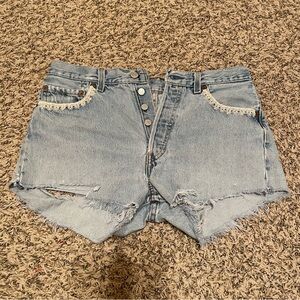 Light blue Levi’s Jean shorts with white lace